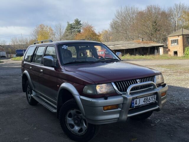 Червоний Міцубісі Паджеро Спорт, об'ємом двигуна 3 л та пробігом 350 тис. км за 3500 $, фото 1 на Automoto.ua