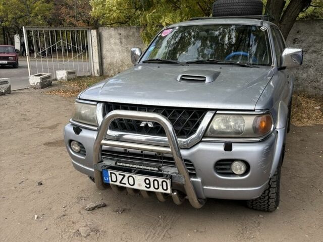 Серый Мицубиси Паджеро Спорт, объемом двигателя 2.5 л и пробегом 283 тыс. км за 7000 $, фото 1 на Automoto.ua
