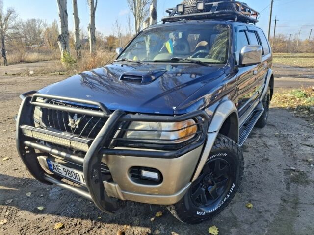 Синій Міцубісі Паджеро Спорт, об'ємом двигуна 2.5 л та пробігом 380 тис. км за 7999 $, фото 1 на Automoto.ua