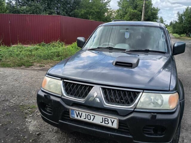 Синий Мицубиси Паджеро Спорт, объемом двигателя 2.5 л и пробегом 300 тыс. км за 4500 $, фото 1 на Automoto.ua