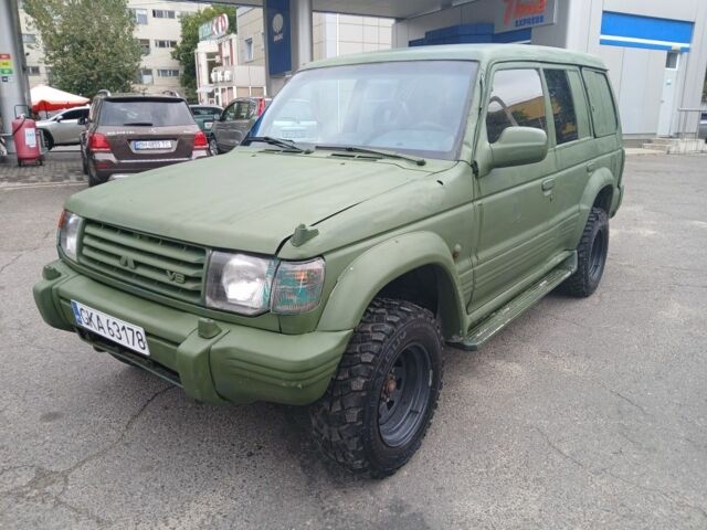 Зелений Міцубісі Паджеро Спорт, об'ємом двигуна 3 л та пробігом 300 тис. км за 2899 $, фото 1 на Automoto.ua