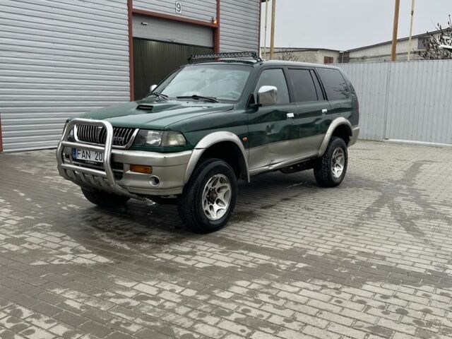 Зеленый Мицубиси Паджеро Спорт, объемом двигателя 2.5 л и пробегом 111 тыс. км за 3000 $, фото 1 на Automoto.ua