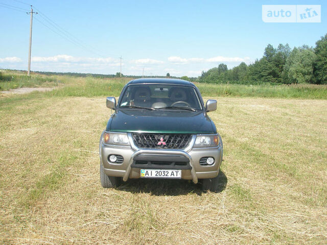 Зелений Міцубісі Паджеро Спорт, об'ємом двигуна 3 л та пробігом 150 тис. км за 7000 $, фото 1 на Automoto.ua