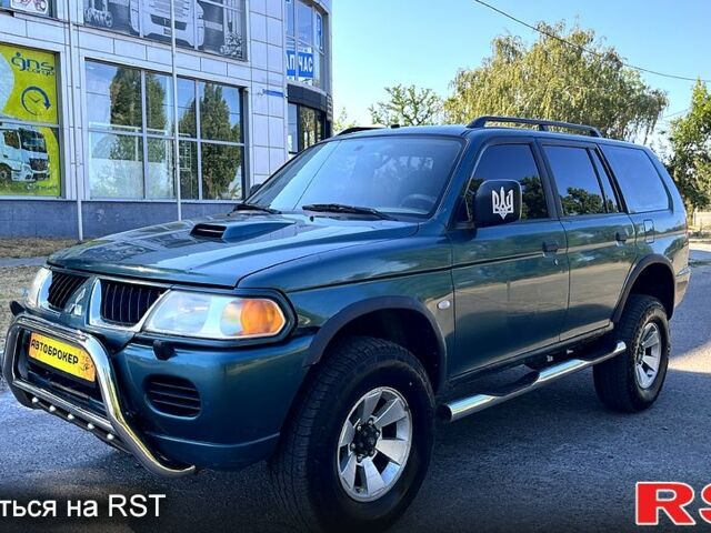 Зеленый Мицубиси Паджеро Спорт, объемом двигателя 2.5 л и пробегом 273 тыс. км за 4900 $, фото 1 на Automoto.ua