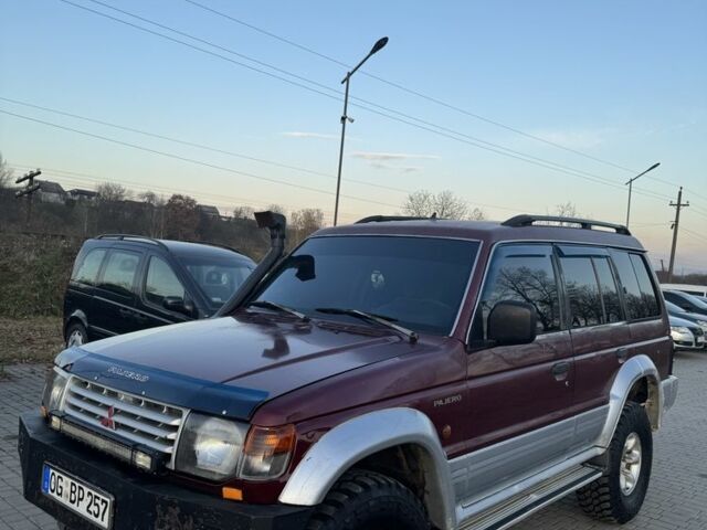 Красный Мицубиси Паджеро, объемом двигателя 2.5 л и пробегом 250 тыс. км за 5700 $, фото 1 на Automoto.ua