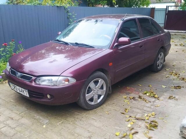 Красный Мицубиси Протон, объемом двигателя 1.3 л и пробегом 290 тыс. км за 1200 $, фото 1 на Automoto.ua