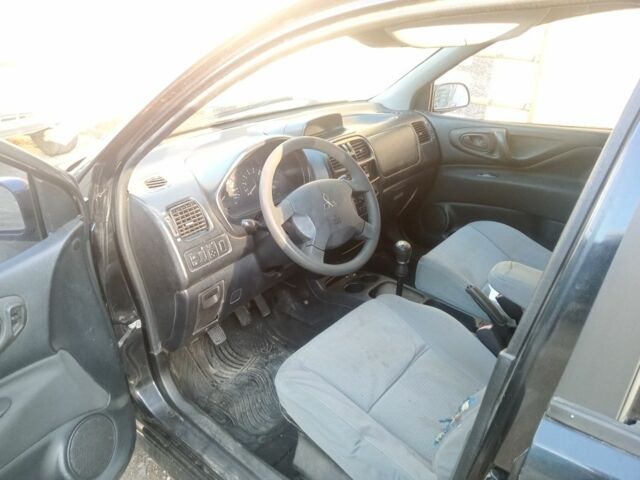 Черный Мицубиси Спейс Стар, объемом двигателя 1 л и пробегом 356 тыс. км за 2000 $, фото 1 на Automoto.ua