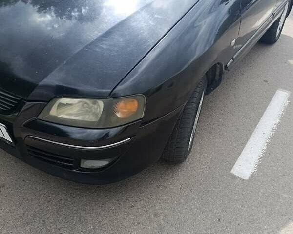 Чорний Міцубісі Спейс Стар, об'ємом двигуна 1.6 л та пробігом 210 тис. км за 2000 $, фото 1 на Automoto.ua