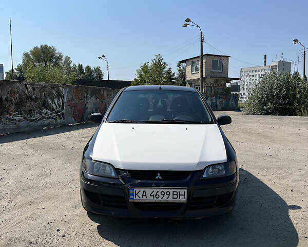 Міцубісі Спейс Стар 2004 у Києві на Automoto.ua Чорний Міцубісі Спейс Стар, об'ємом двигуна 1.6 л та пробігом 275 тис. км за 3500 $, фото 1 на Automoto.ua