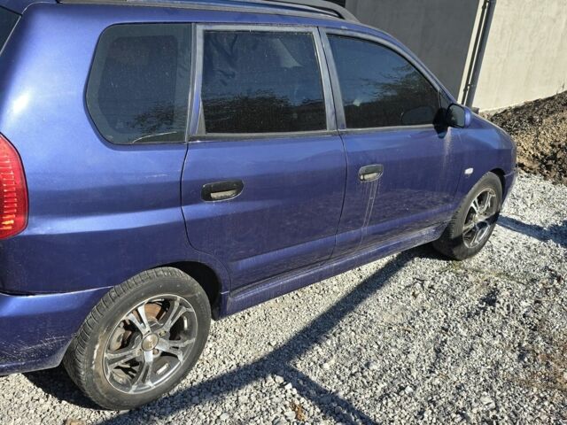 Синий Мицубиси Спейс Стар, объемом двигателя 1.6 л и пробегом 300 тыс. км за 2000 $, фото 1 на Automoto.ua