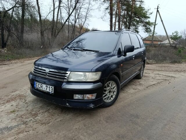 Синий Мицубиси Спейс Вагон, объемом двигателя 2.4 л и пробегом 333 тыс. км за 1000 $, фото 1 на Automoto.ua