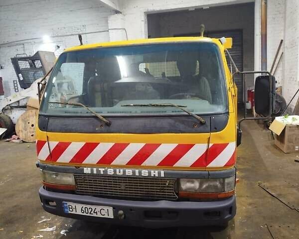 Желтый Мицубиси Fuso Canter, объемом двигателя 3.91 л и пробегом 300 тыс. км за 5200 $, фото 1 на Automoto.ua