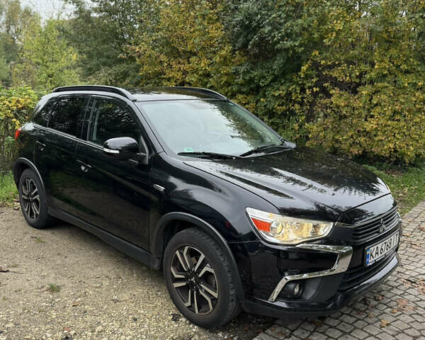 Черный Мицубиси Outlander Sport, объемом двигателя 2.4 л и пробегом 140 тыс. км за 11000 $, фото 1 на Automoto.ua