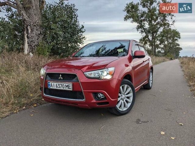 Красный Мицубиси Outlander Sport, объемом двигателя 2 л и пробегом 130 тыс. км за 10500 $, фото 1 на Automoto.ua
