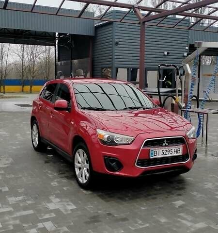 Красный Мицубиси Outlander Sport, объемом двигателя 2 л и пробегом 220 тыс. км за 11500 $, фото 1 на Automoto.ua