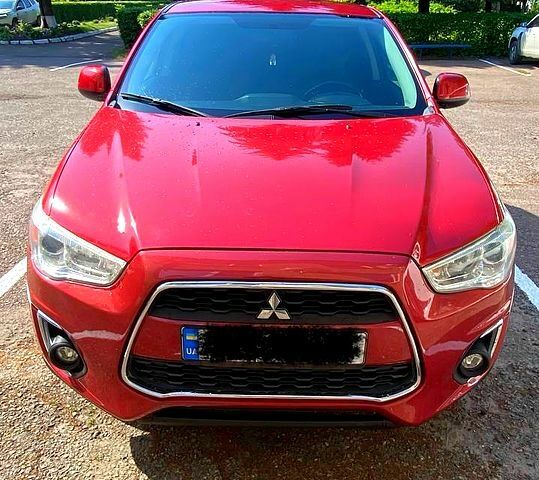 Красный Мицубиси Outlander Sport, объемом двигателя 2.4 л и пробегом 214 тыс. км за 11000 $, фото 1 на Automoto.ua
