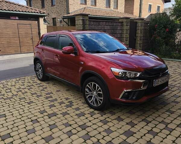 Красный Мицубиси Outlander Sport, объемом двигателя 2 л и пробегом 108 тыс. км за 14900 $, фото 1 на Automoto.ua