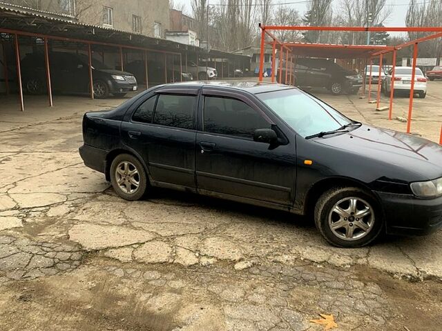 Черный Ниссан Альмера, объемом двигателя 1.4 л и пробегом 0 тыс. км за 1700 $, фото 1 на Automoto.ua