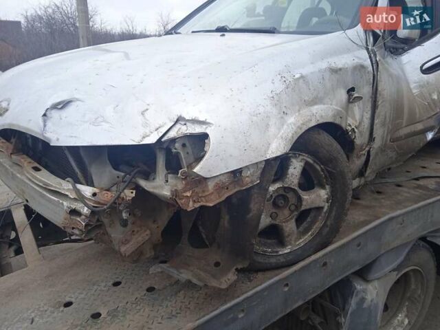 Серый Ниссан Альмера, объемом двигателя 2.2 л и пробегом 340 тыс. км за 400 $, фото 1 на Automoto.ua