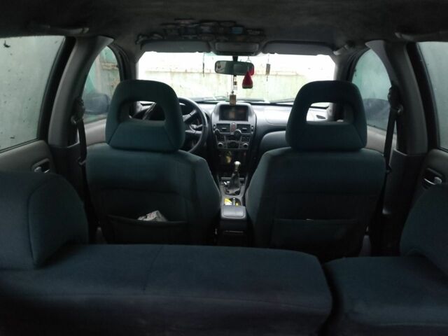 Сірий Ніссан Альмера, об'ємом двигуна 2 л та пробігом 400 тис. км за 1800 $, фото 1 на Automoto.ua