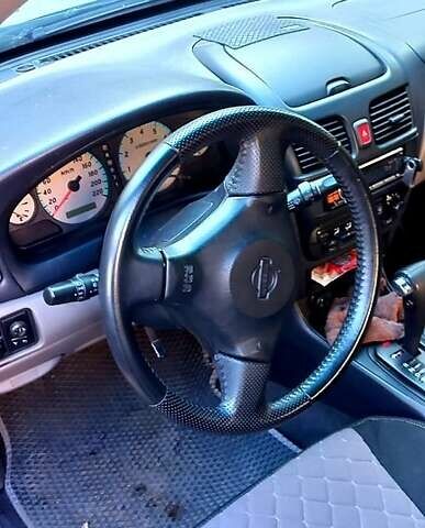 Серый Ниссан Альмера, объемом двигателя 1.8 л и пробегом 280 тыс. км за 3001 $, фото 1 на Automoto.ua