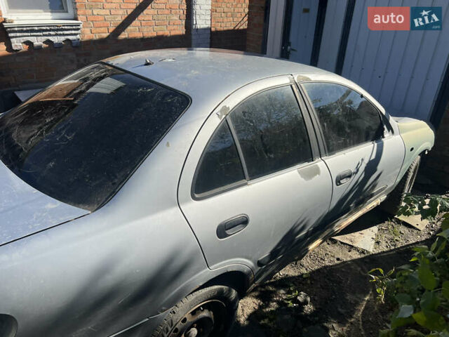 Серый Ниссан Альмера, объемом двигателя 1.5 л и пробегом 240 тыс. км за 1700 $, фото 1 на Automoto.ua