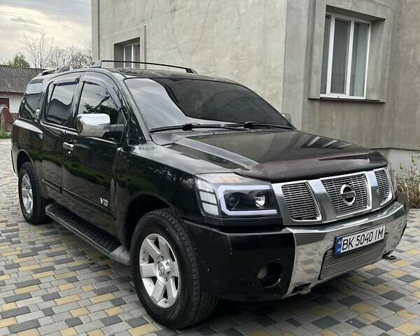 Черный Ниссан Армада, объемом двигателя 5.6 л и пробегом 255 тыс. км за 9000 $, фото 1 на Automoto.ua