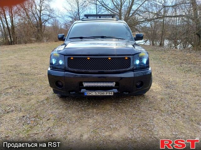 Черный Ниссан Армада, объемом двигателя 5.6 л и пробегом 255 тыс. км за 8000 $, фото 1 на Automoto.ua