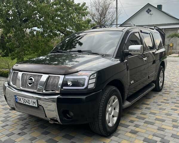 Чорний Ніссан Armada, об'ємом двигуна 5.6 л та пробігом 244 тис. км за 10999 $, фото 1 на Automoto.ua