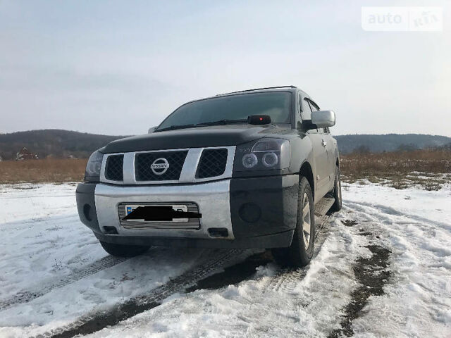 Чорний Ніссан Armada, об'ємом двигуна 5.6 л та пробігом 211 тис. км за 12500 $, фото 1 на Automoto.ua