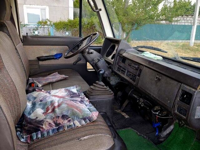 Белый Ниссан Атлас, объемом двигателя 2.3 л и пробегом 146 тыс. км за 3600 $, фото 1 на Automoto.ua