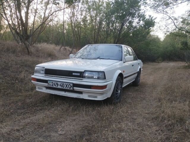 Белый Ниссан Блюберд, объемом двигателя 2 л и пробегом 387 тыс. км за 1200 $, фото 1 на Automoto.ua