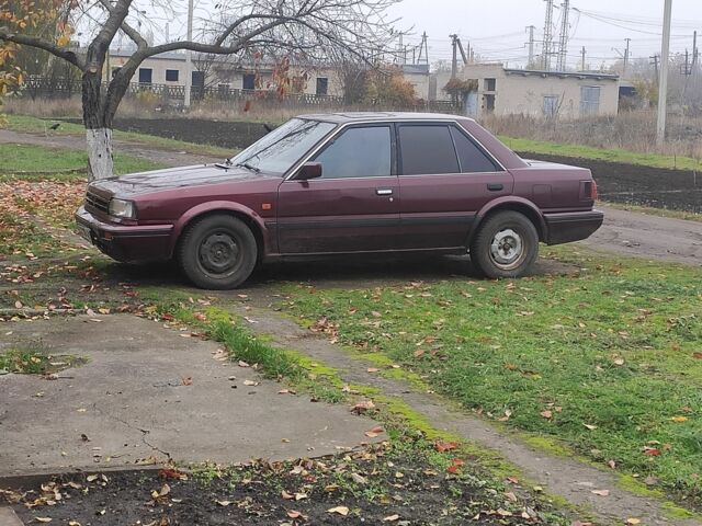 Красный Ниссан Блюберд, объемом двигателя 2 л и пробегом 40 тыс. км за 550 $, фото 1 на Automoto.ua