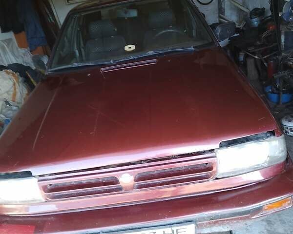 Красный Ниссан Блюберд, объемом двигателя 2 л и пробегом 196 тыс. км за 1700 $, фото 1 на Automoto.ua