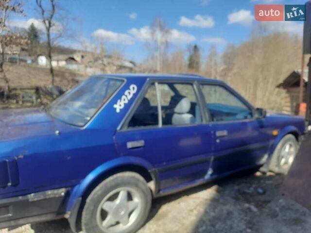Синий Ниссан Блюберд, объемом двигателя 2 л и пробегом 307 тыс. км за 950 $, фото 1 на Automoto.ua