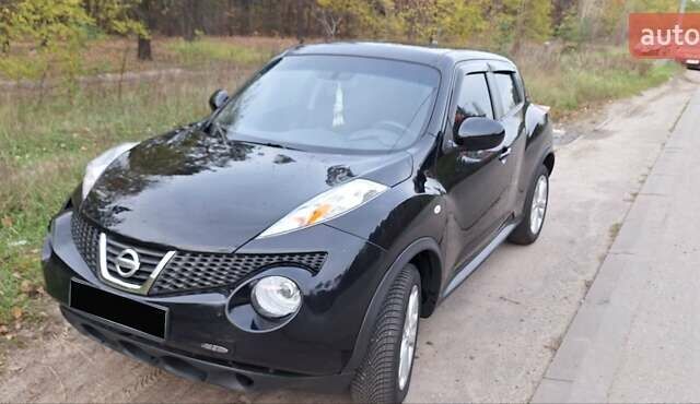 Черный Ниссан Жук, объемом двигателя 1.6 л и пробегом 170 тыс. км за 11000 $, фото 1 на Automoto.ua