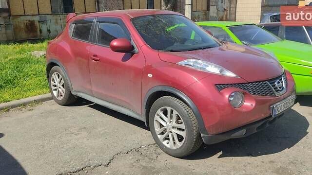 Красный Ниссан Жук, объемом двигателя 1.6 л и пробегом 175 тыс. км за 11000 $, фото 1 на Automoto.ua