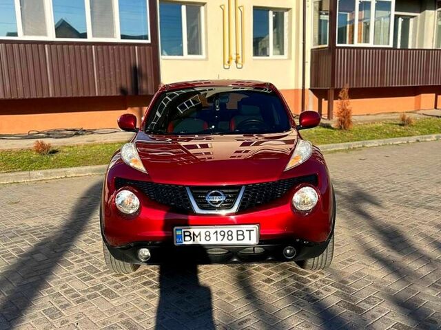 Красный Ниссан Жук, объемом двигателя 1.6 л и пробегом 95 тыс. км за 9300 $, фото 1 на Automoto.ua