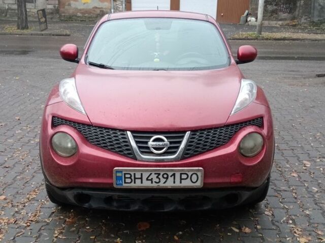 Красный Ниссан Жук, объемом двигателя 2 л и пробегом 126 тыс. км за 8900 $, фото 1 на Automoto.ua