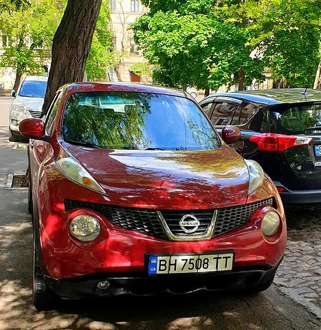 Червоний Ніссан Жук, об'ємом двигуна 1.6 л та пробігом 168 тис. км за 9800 $, фото 1 на Automoto.ua