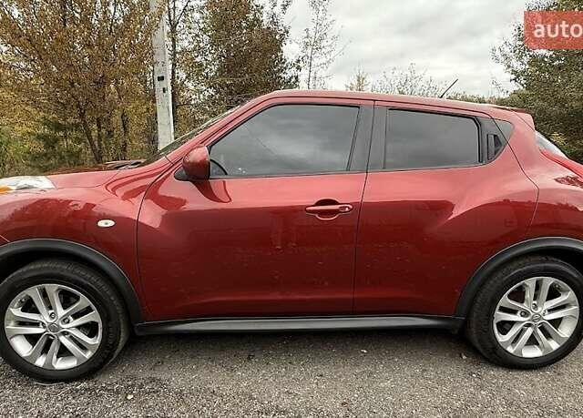 Красный Ниссан Жук, объемом двигателя 1.62 л и пробегом 209 тыс. км за 10500 $, фото 1 на Automoto.ua