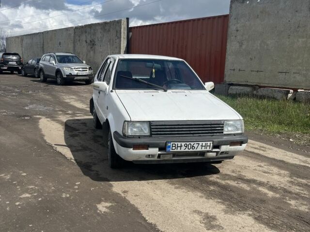 Белый Ниссан Марч, объемом двигателя 1 л и пробегом 140 тыс. км за 1000 $, фото 1 на Automoto.ua