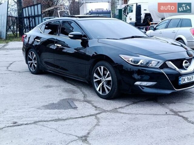 Черный Ниссан Максима, объемом двигателя 3.5 л и пробегом 107 тыс. км за 16500 $, фото 1 на Automoto.ua