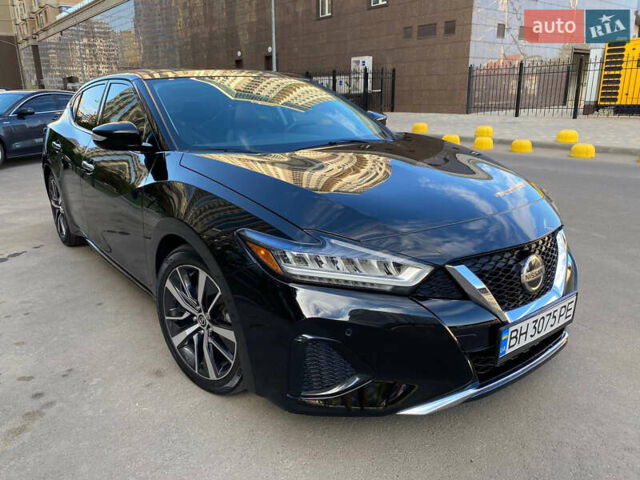 Черный Ниссан Максима, объемом двигателя 3.5 л и пробегом 128 тыс. км за 19700 $, фото 1 на Automoto.ua