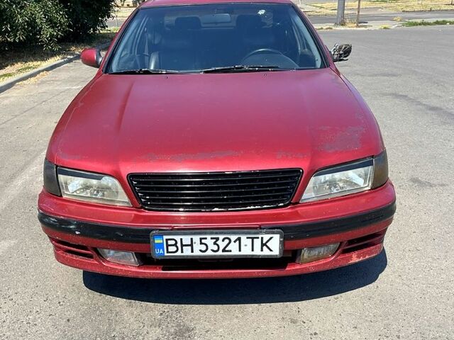 Красный Ниссан Максима, объемом двигателя 2 л и пробегом 350 тыс. км за 1500 $, фото 1 на Automoto.ua