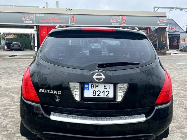 Черный Ниссан Мурано, объемом двигателя 3.5 л и пробегом 250 тыс. км за 5700 $, фото 1 на Automoto.ua