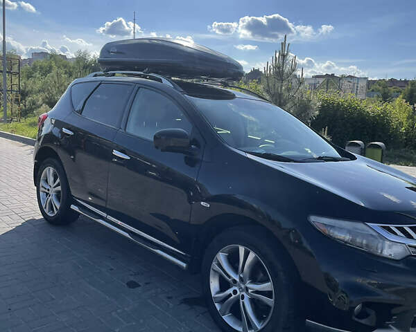 Черный Ниссан Мурано, объемом двигателя 2.49 л и пробегом 245 тыс. км за 15500 $, фото 1 на Automoto.ua