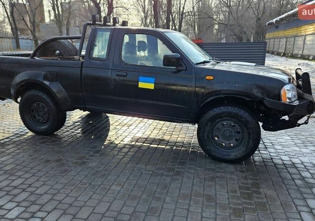 Чорний Ніссан Навара, об'ємом двигуна 2.5 л та пробігом 245 тис. км за 6850 $, фото 1 на Automoto.ua