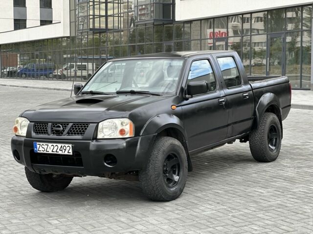Черный Ниссан Навара, объемом двигателя 2.5 л и пробегом 297 тыс. км за 3999 $, фото 1 на Automoto.ua