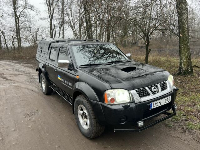 Черный Ниссан Навара, объемом двигателя 2.5 л и пробегом 213 тыс. км за 6000 $, фото 1 на Automoto.ua
